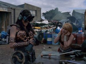 Xena fixing her sword in present day times